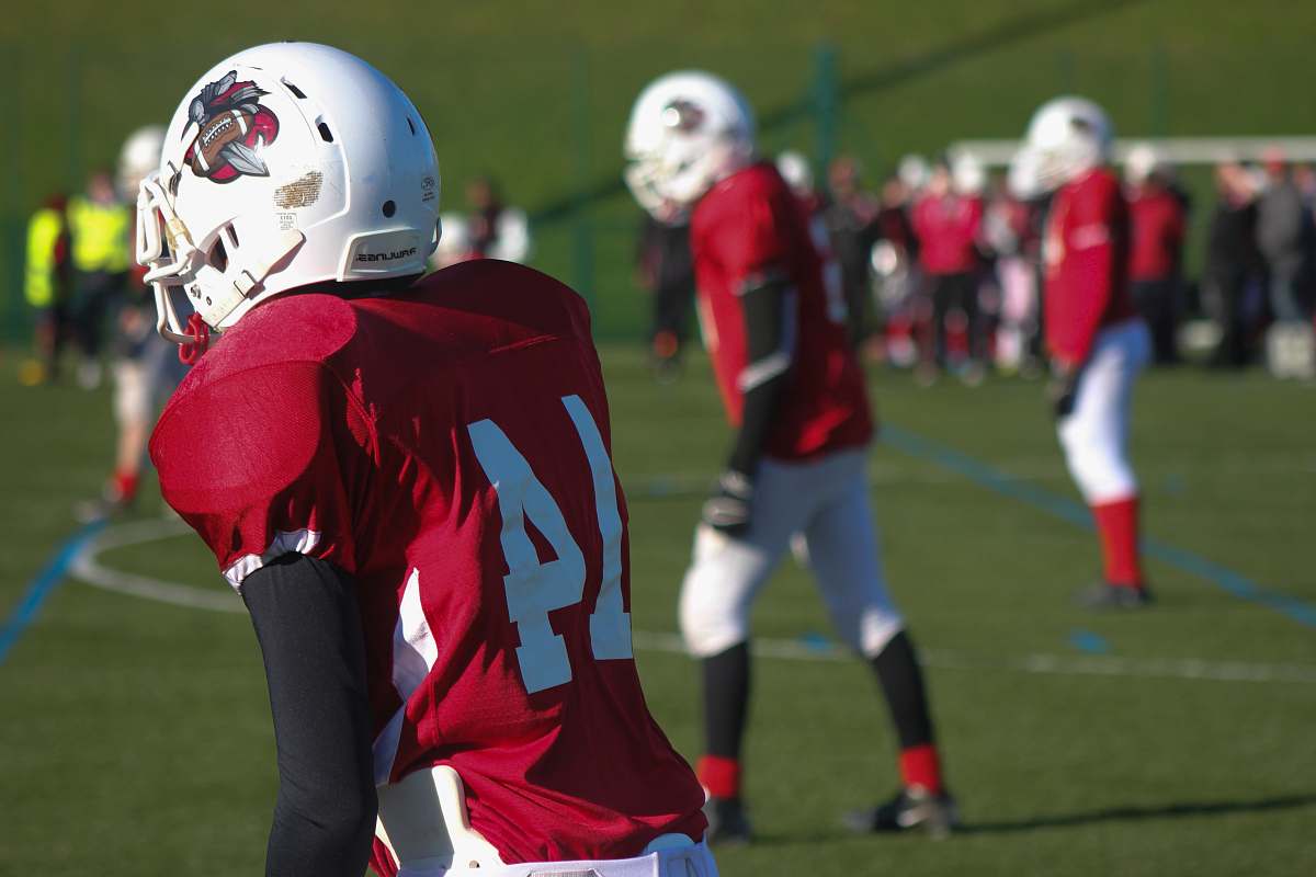 helmet selective focus photography of American football 14 player american football